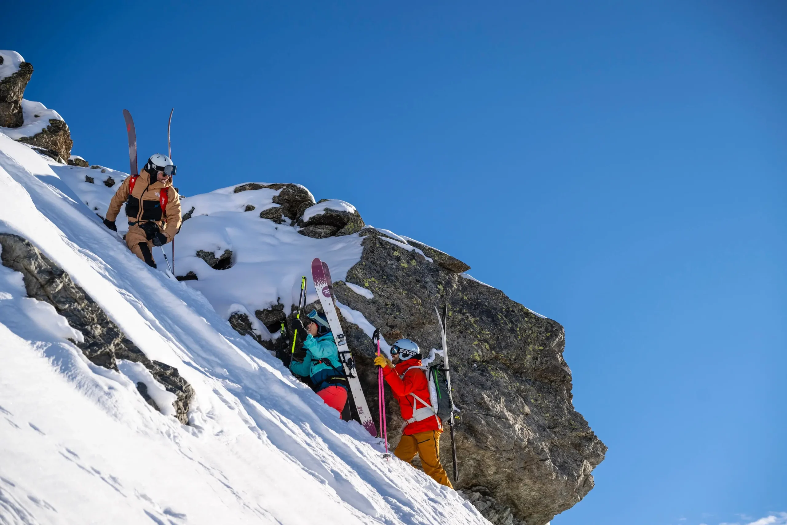 A ski instructor guiding people as part of a lesson