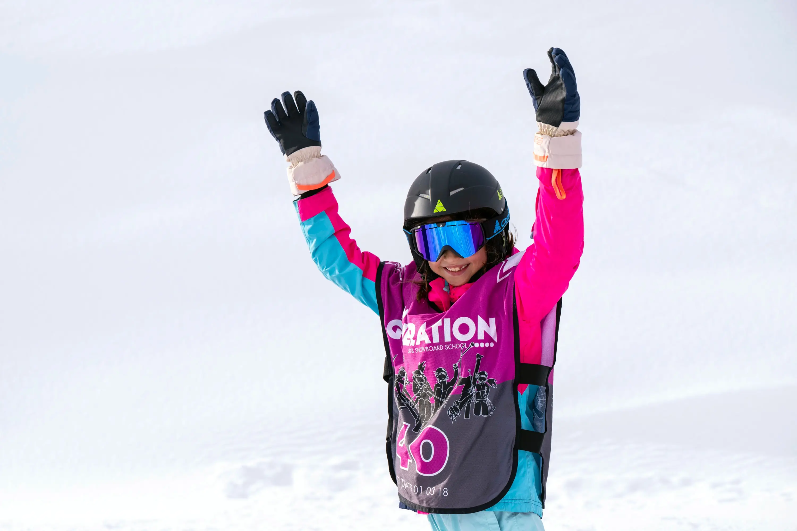 A happy child in their ski lessons